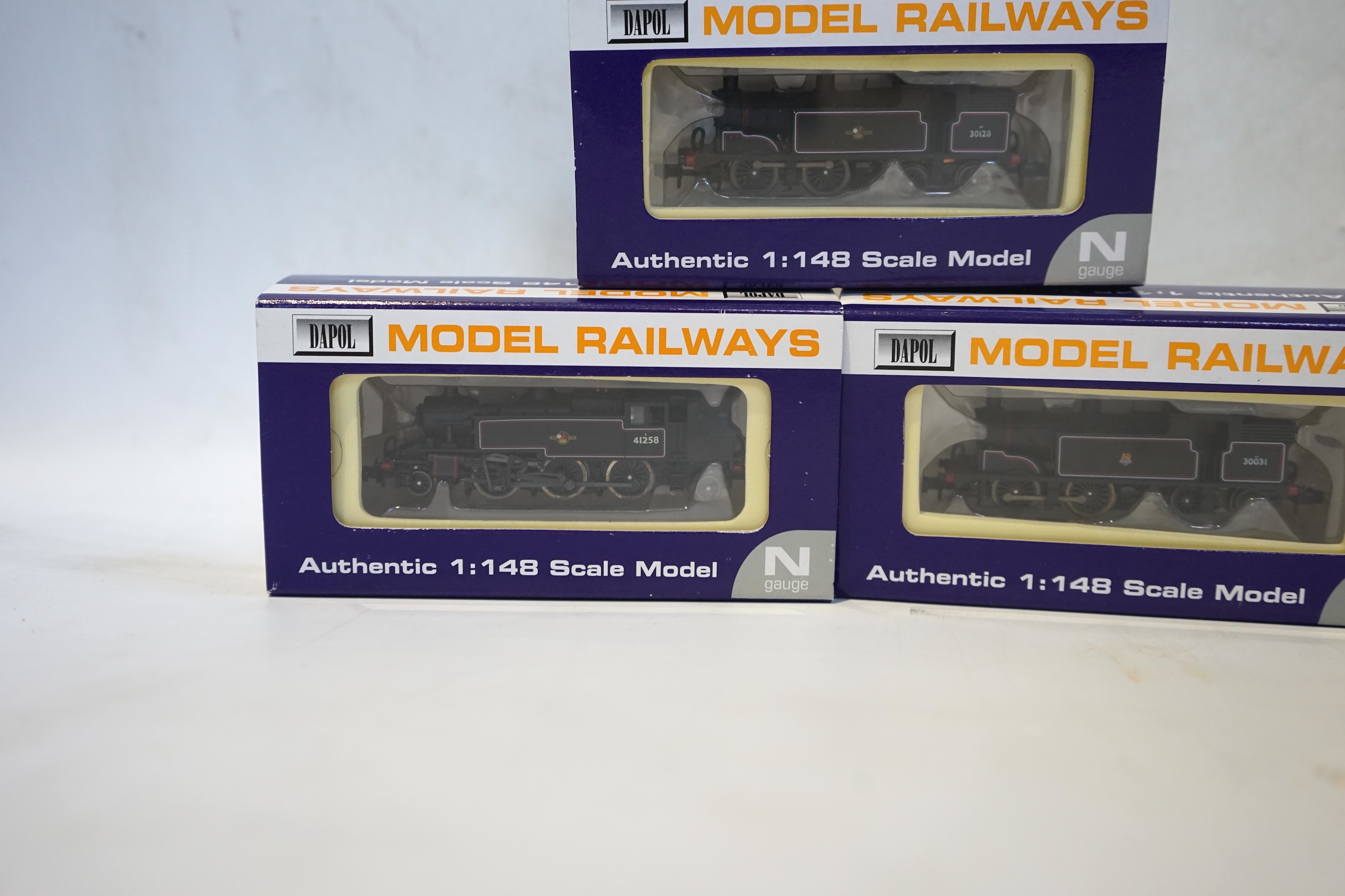 Three boxed Dapol N gauge railway BR tank locomotives; an Ivatt 2-6-2T, 41258 (ND-061B), a Class M7, 30128 (ND-045), and a Class M7, 30031 (ND-025). Condition - good.